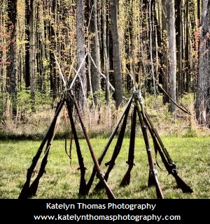 Rifles stacked into a triangle or pyramid